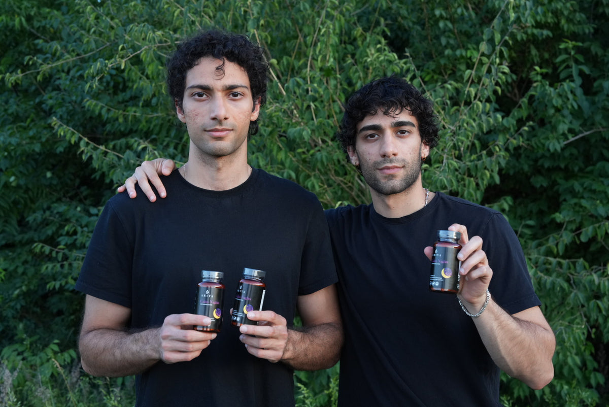 Aria and Arian holding bottles of Calm Nights